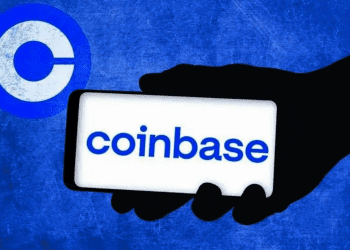 Coinbase Logo with Coinbase Text on Phone being Held