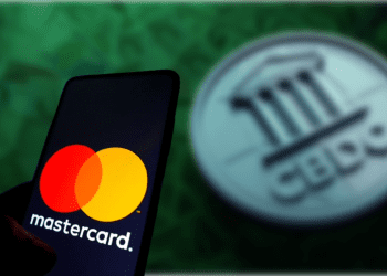 Mastercard logo on phone with CBDC in background