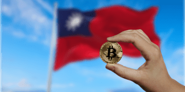 Taiwan Flag with Bitcoin in Human Hand