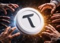 Hands reach in from all sides toward a glowing white disc with a bold black T logo, suggesting teamwork around a crypto token.