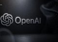 Metallic OpenAI logo and wordmark on a dark textured background with a BlockNews watermark in the corner.