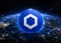 A blue crypto coin with a white hexagon emblem hovering above a glowing Earth connected by network lines, symbolizing global blockchain connectivity.