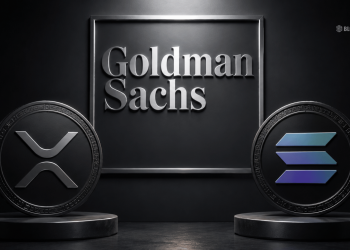 Framed Goldman Sachs sign flanked by large XRP and Solana coins on dark pedestals.
