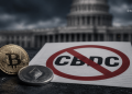Bitcoin and Ethereum coins beside a document with a large 'No CBDC' symbol, set against a dark government building backdrop.