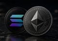 Close-up of Solana and Ethereum cryptocurrency coins on a dark marble surface.