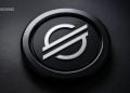 BlockNews logo: metallic circular emblem with a stylized E on a dark textured background.