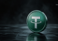 Close-up of a green cryptocurrency coin with a white stylized 'T' logo, resting on a reflective surface in a dark, smoky background.