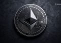 Close-up of a metallic Ethereum coin with circuit designs on a dark textured background, BlockNews watermark in the top-right corner.