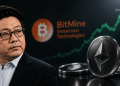 Businessman in suit looking to the left with crypto icons and a large Ethereum coin in the foreground; background shows BitMine Immersion Technologies branding and a rising line chart.