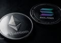 Two cryptocurrency coins—Ethereum on the left and Solana on the right—resting on a dark surface.