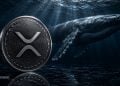 Close-up of a Ripple (XRP) coin with a giant whale swimming underwater in a dark blue sea, BLOCKNEWS watermark visible.