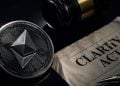 Close-up of an Ethereum coin beside a crumpled legal document and a gavel, illustrating cryptocurrency regulation or law.